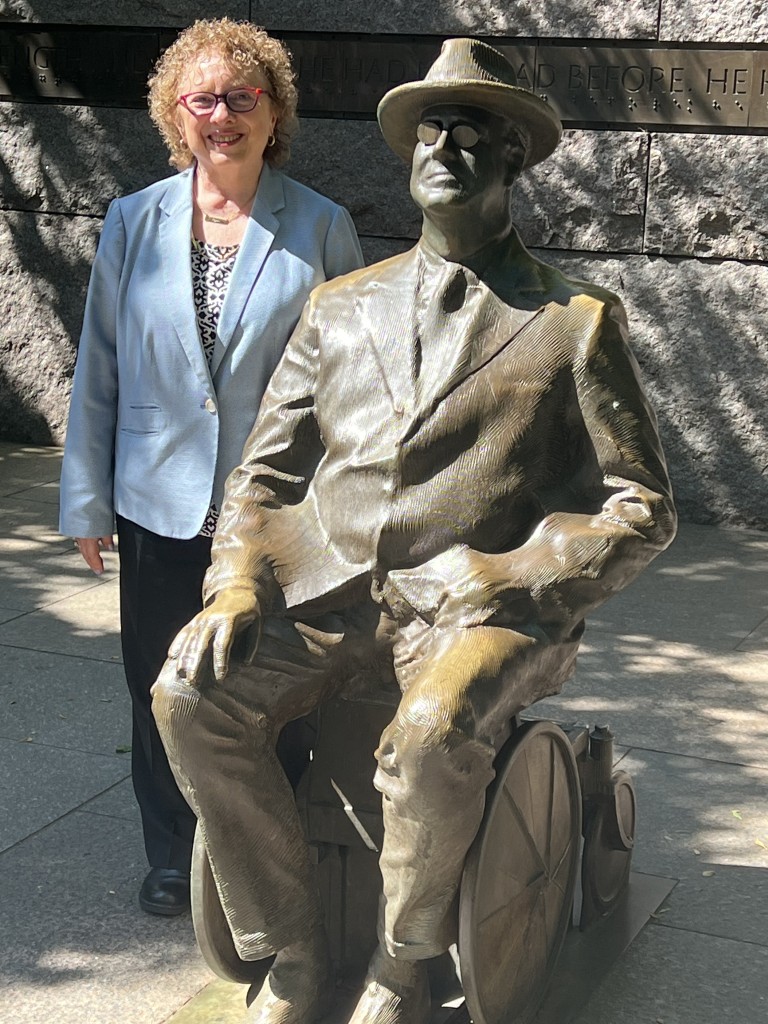 Joyce Bender posing at the FDR Memorial